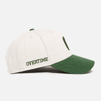 White and green cap with "OVERTIME"