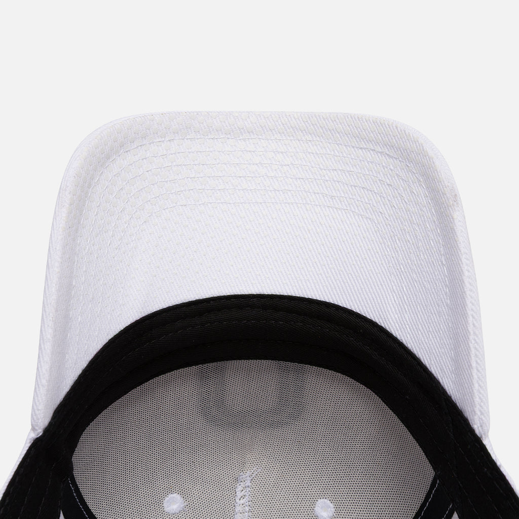 Close-up of a white baseball cap with white brim