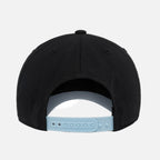 Black cap with a blue snapback