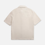 Back of beige short-sleeve collared shirt