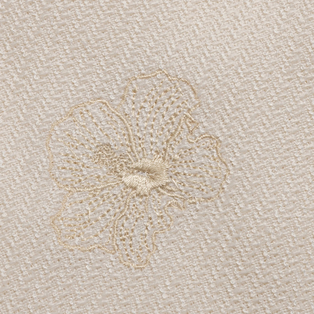 Close-up of oral embroidery design on shirt.