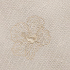 Close-up of oral embroidery design on shirt.
