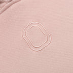Close-up of embroidered "O" logo