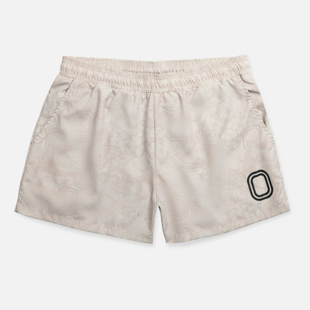 Beige shorts with a black "O"
logo 