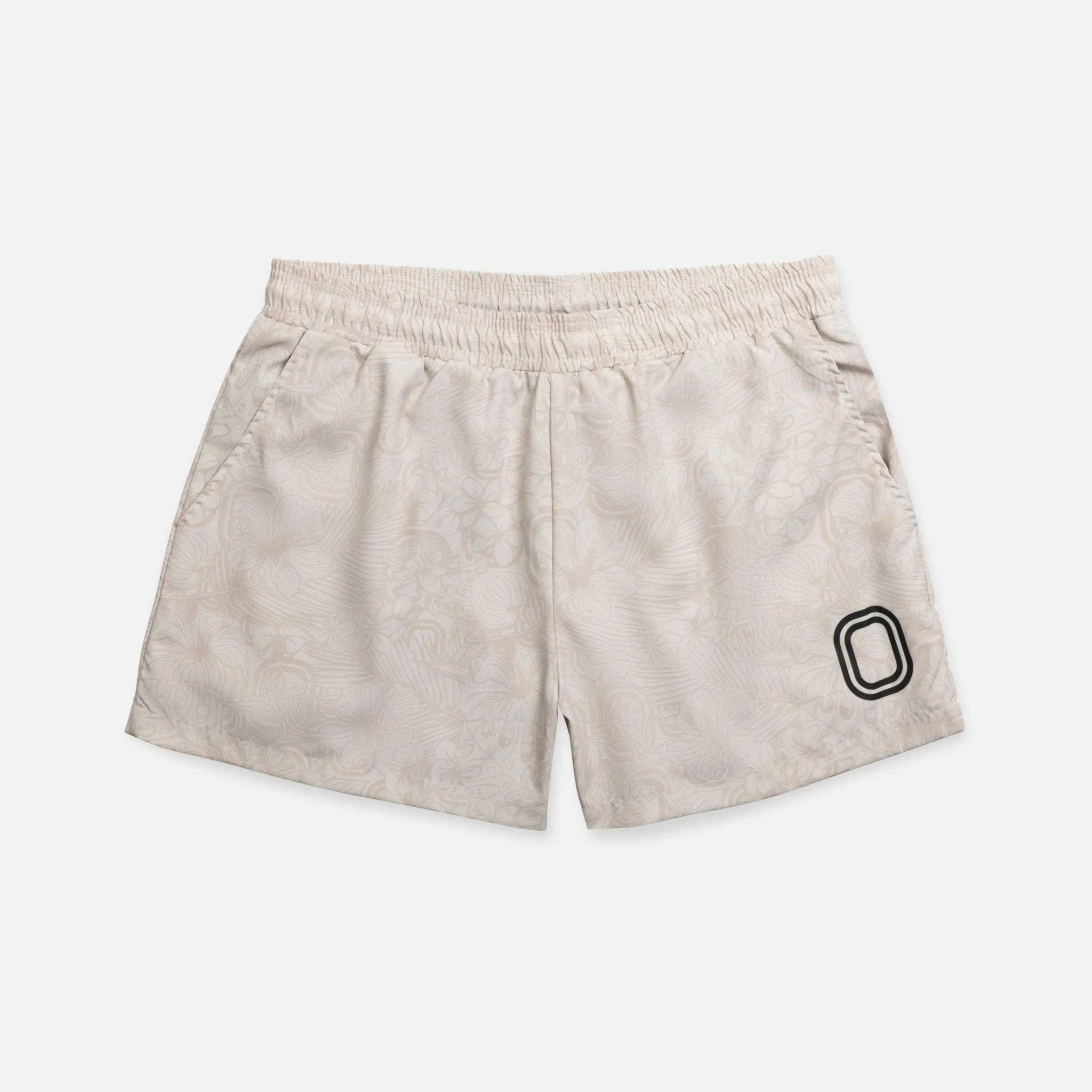 Beige shorts with a black "O"
logo 