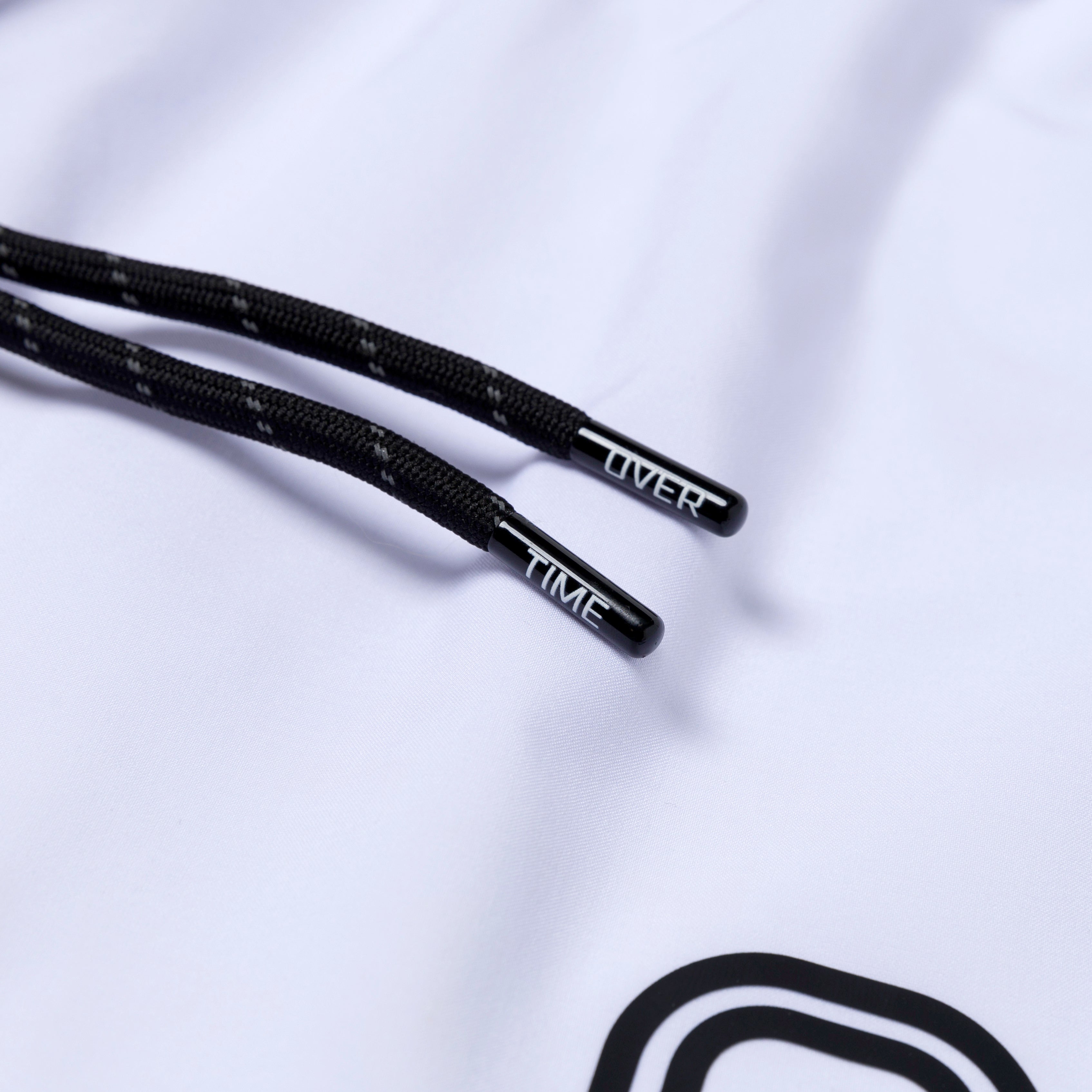 Black drawstrings with "OVERTIME" branding