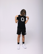 Kid wearing black classic Overtime Tee