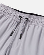 Close-up of gray shorts with drawstrings