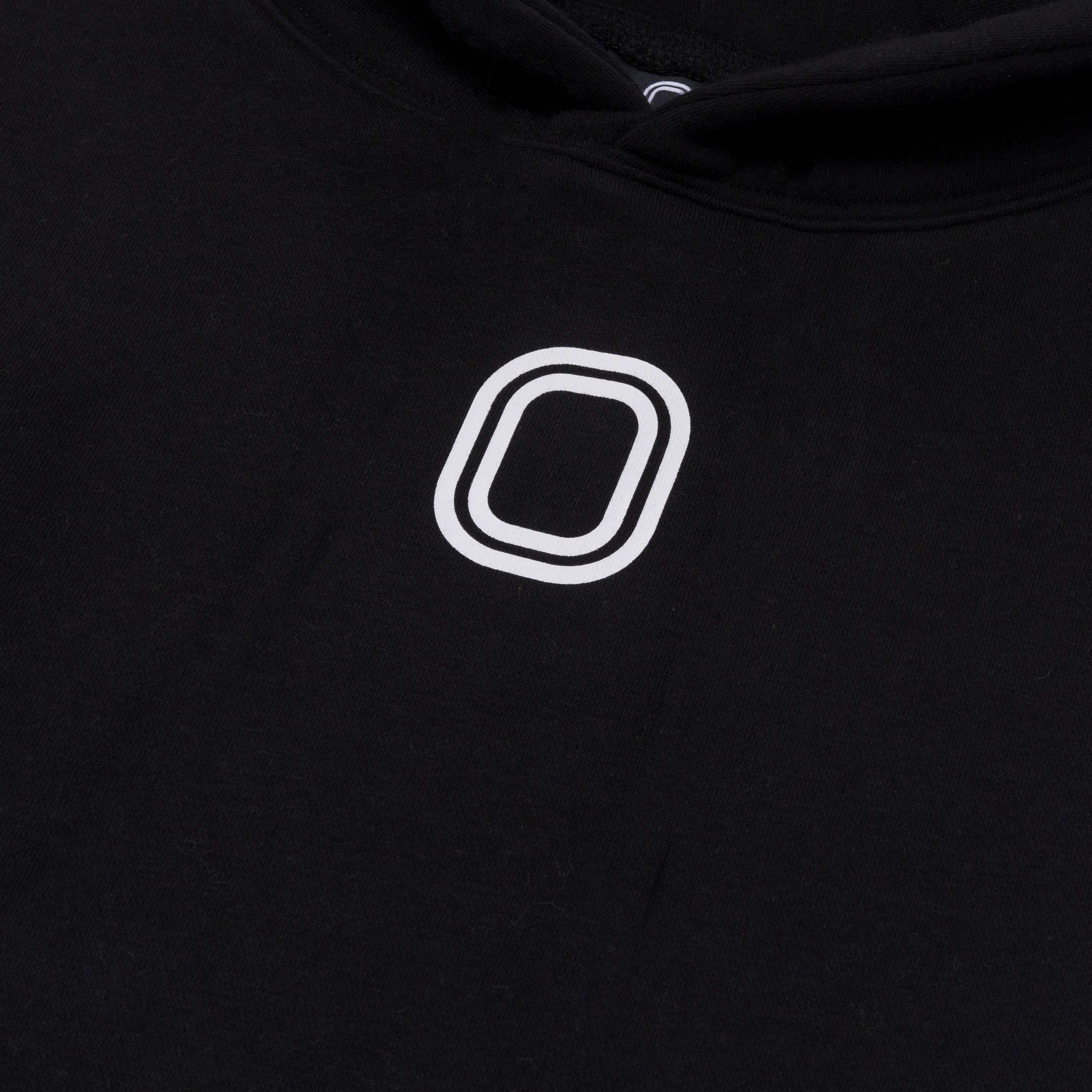 A close-up of 'O' print on the front of the hoodie.