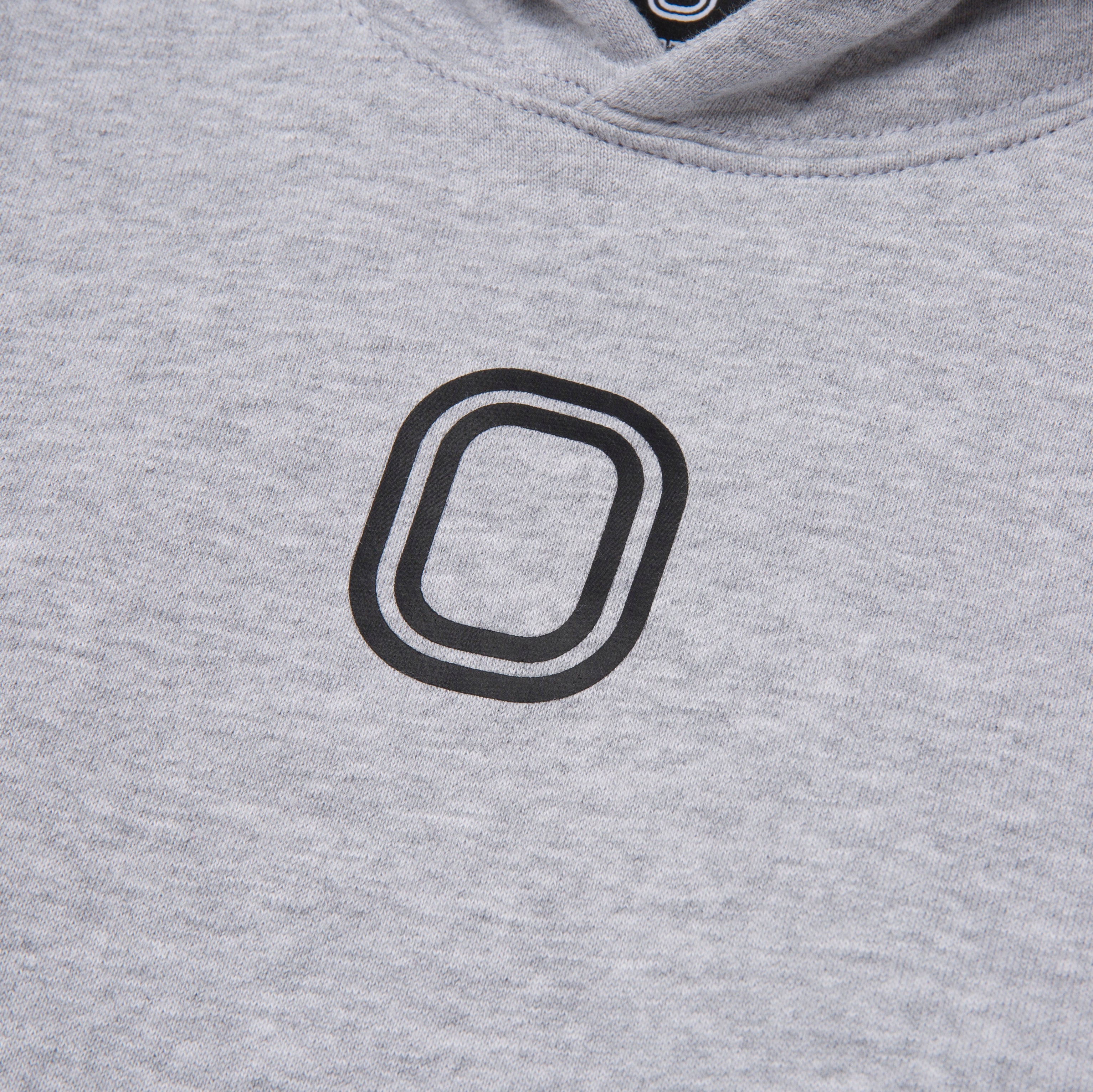 A close-up of 'O' print on the front of the hoodie.