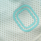 Light blue "O" logo on basketball shorts