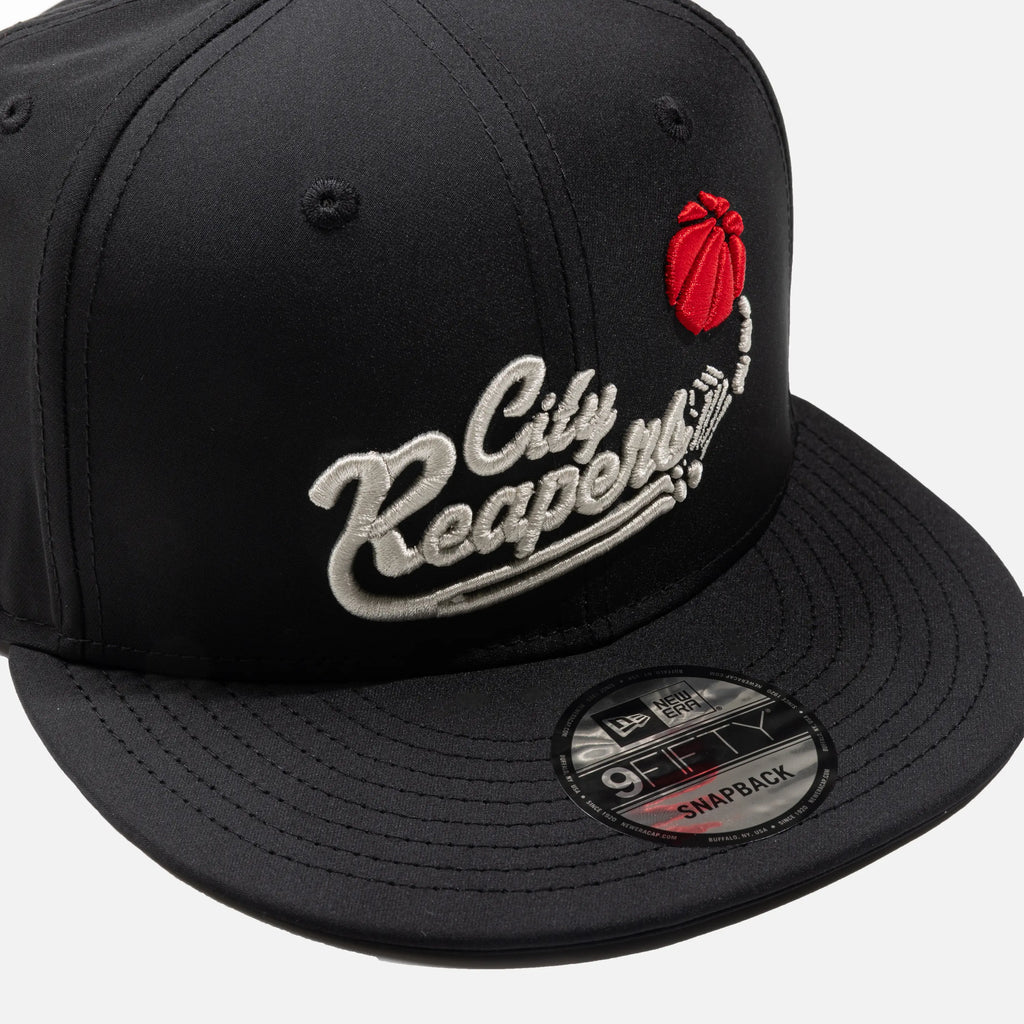 Black snapback cap with 'City Reapers' logo and New Era branding