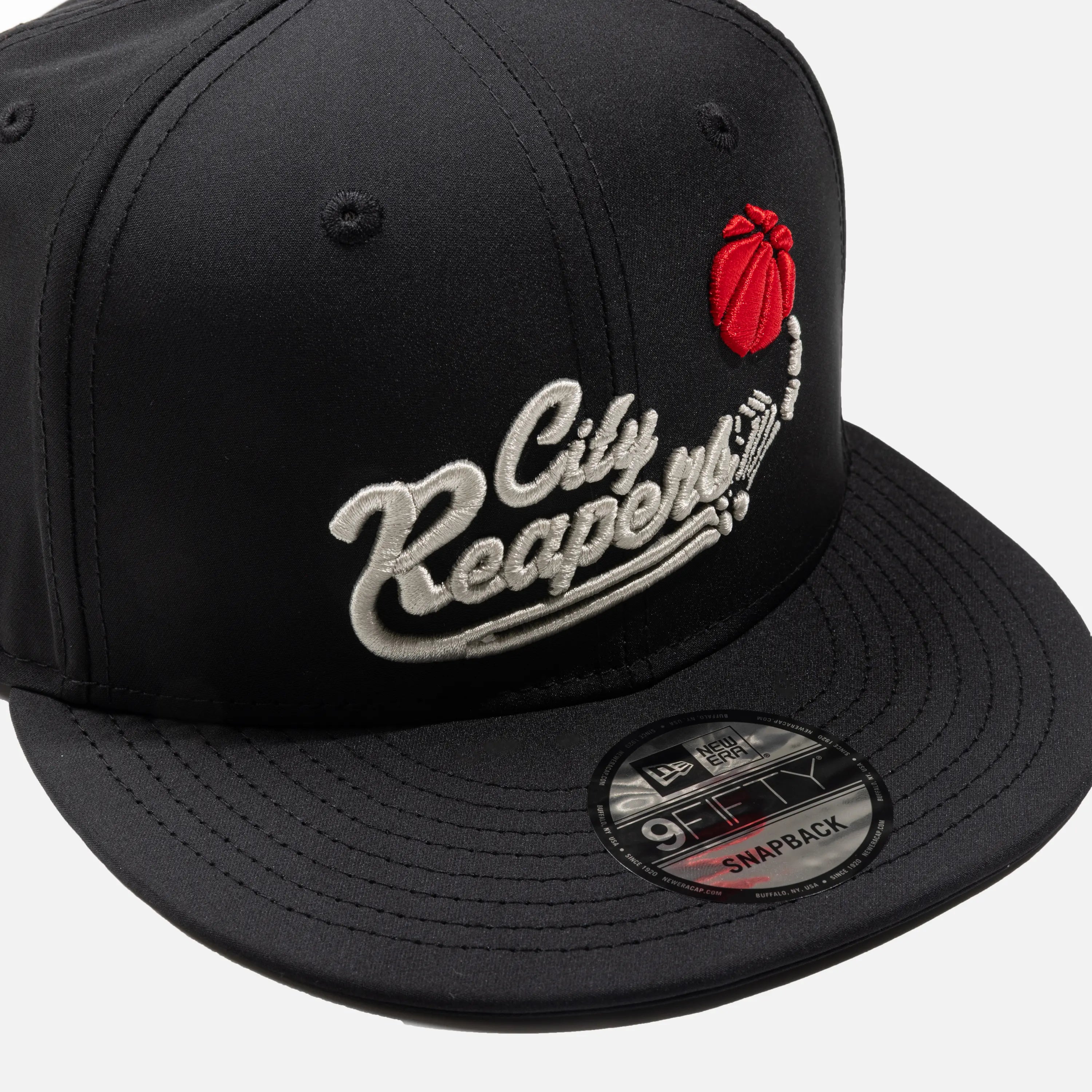 Black snapback cap with 'City Reapers' logo and New Era branding