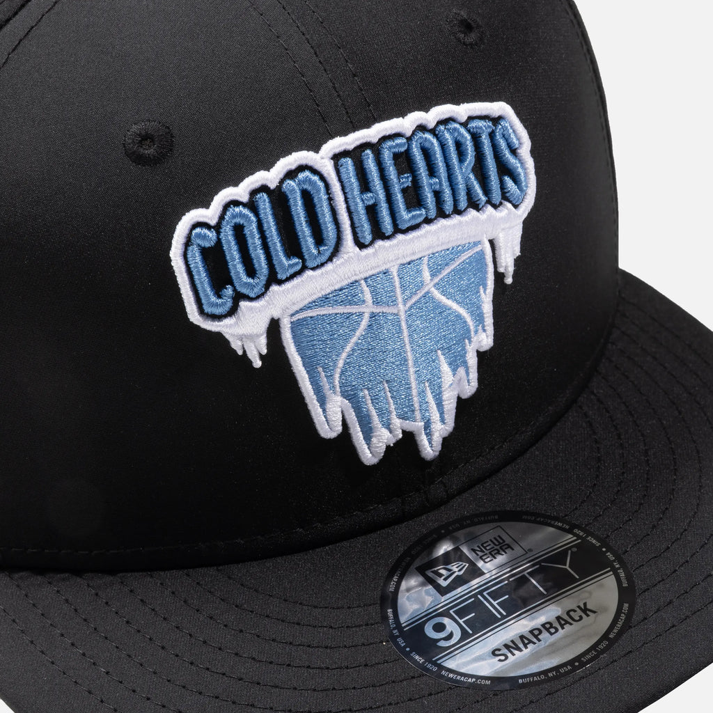 Black snapback cap with 'Cold Hearts' logo and New Era 9FIFTY label