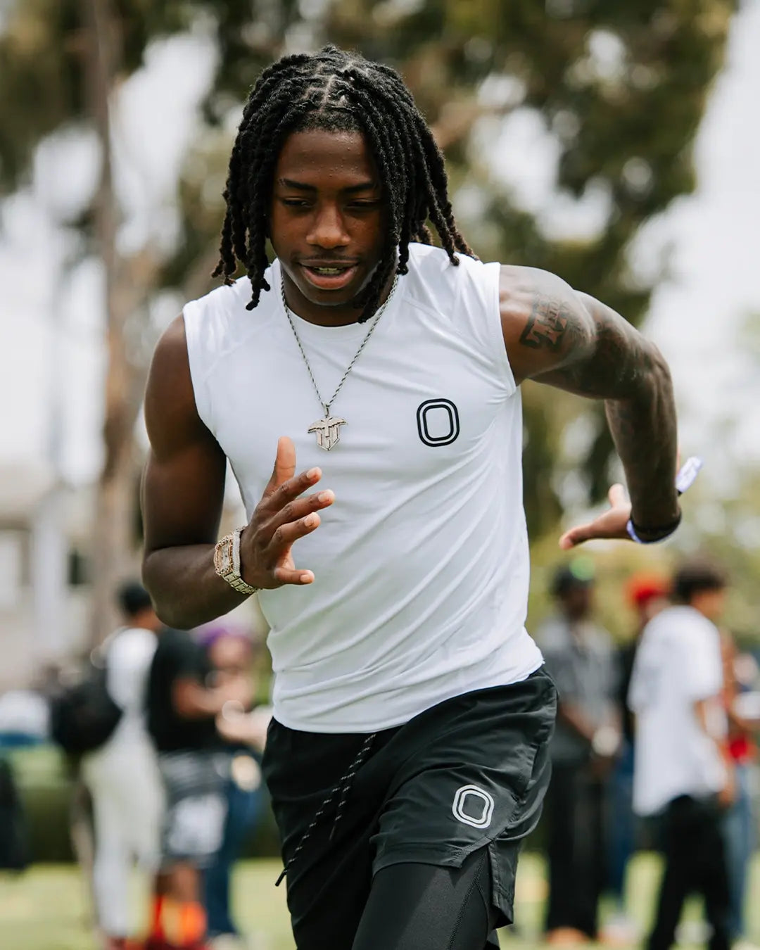 Trayvis Hunter wearing Overtime Compression tank top in white.