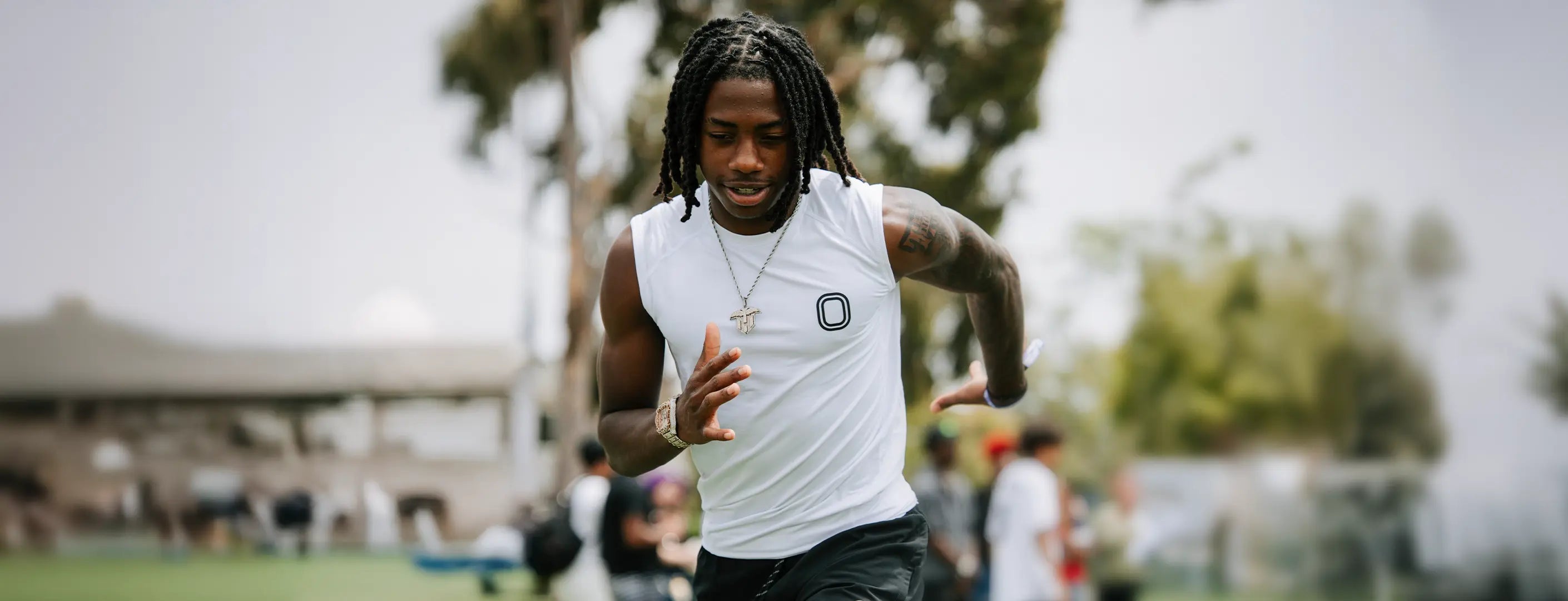 Trayvis Hunter wearing Overtime Compression tank top in white.