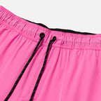 Black drawstring detail on pink workout shorts