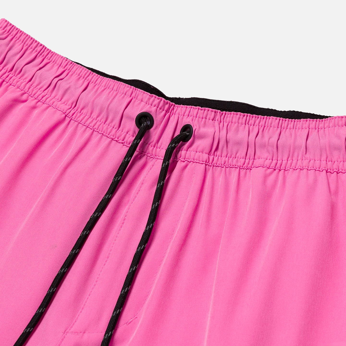 Black drawstring detail on pink workout shorts
