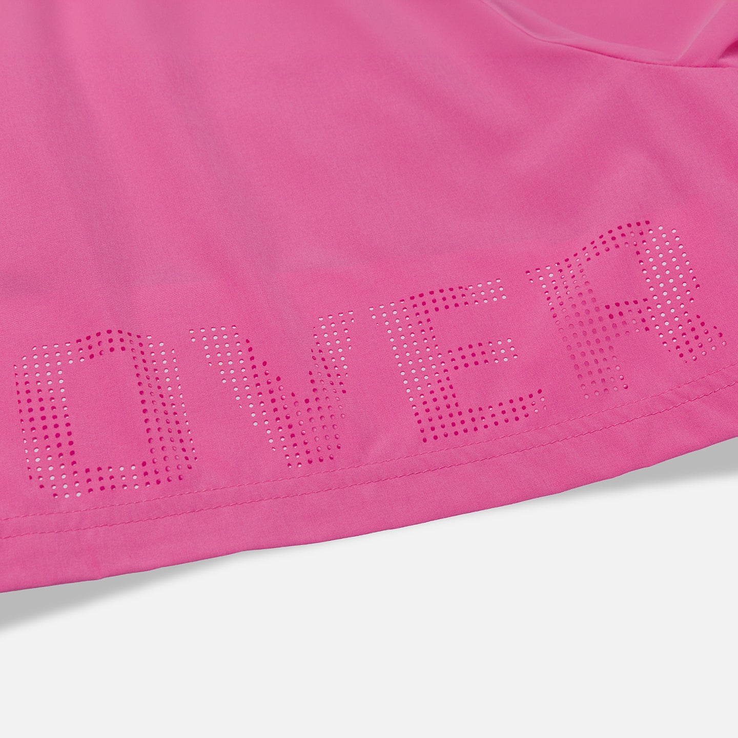 Overtime perforated brand name detail on pink shorts