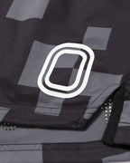 Close-up of a black and gray patterned shorts with white "O" Logo