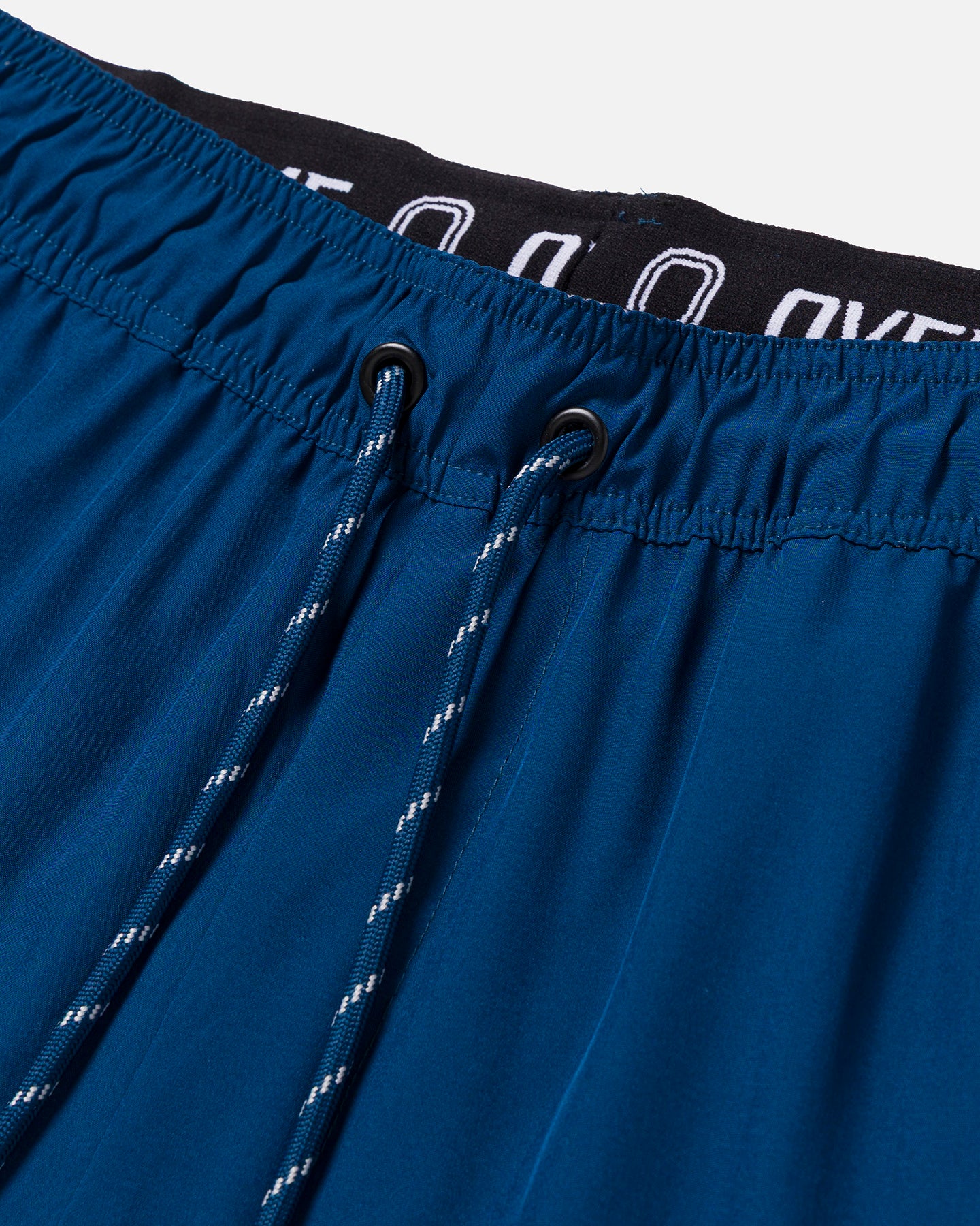 Blue shorts with close-up of drawstrings