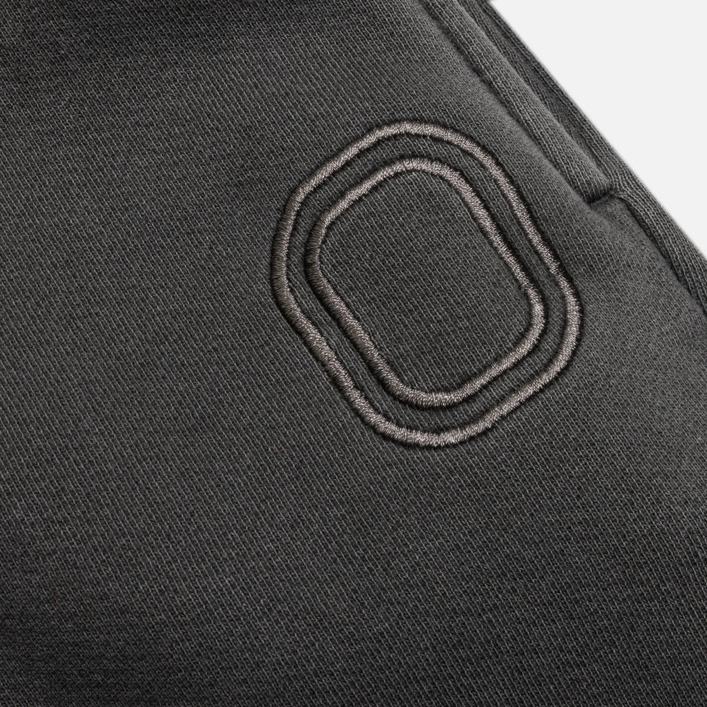 Close-up of an embroidered "O" logo