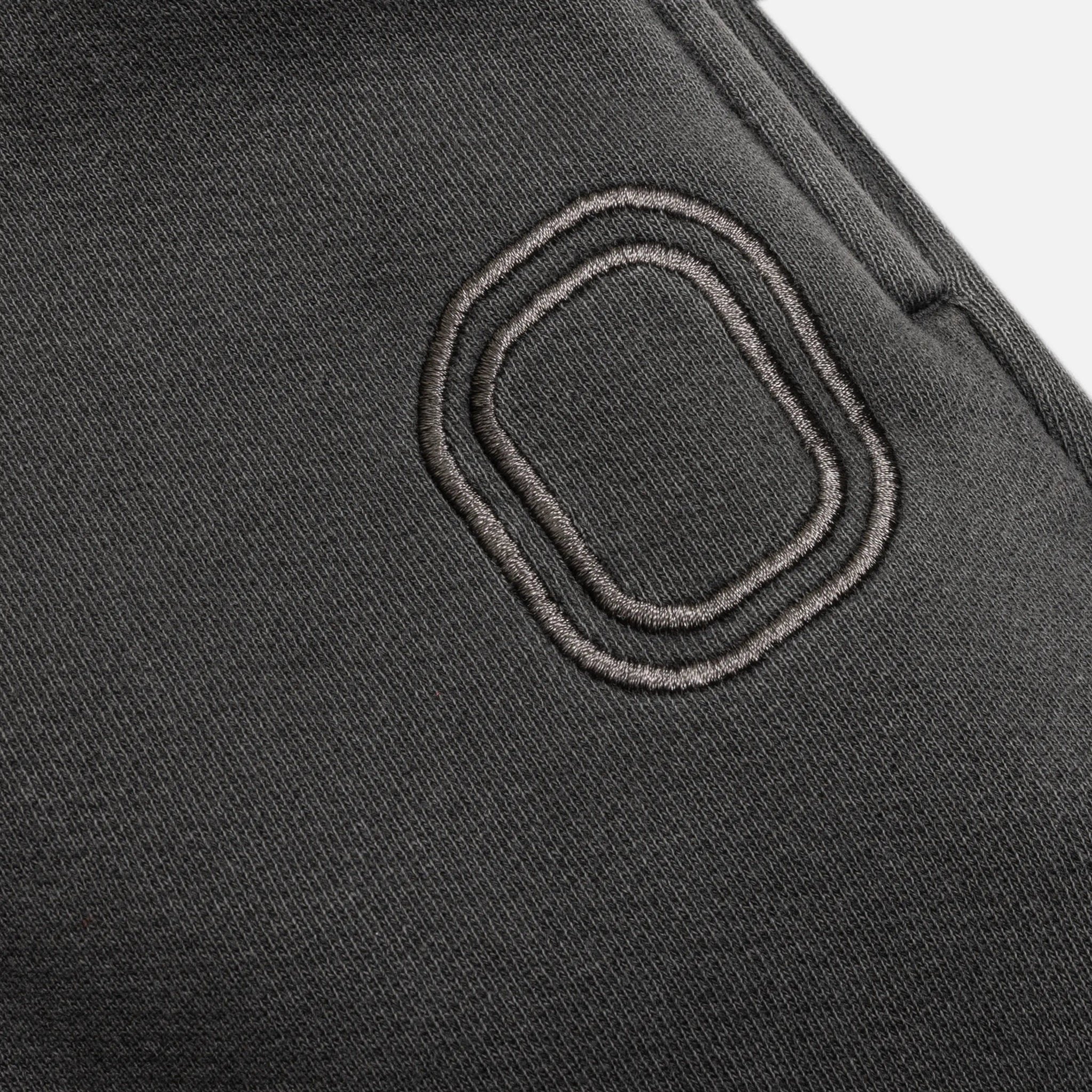 Close-up of an embroidered "O" logo